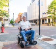 Black folding electric wheelchair.  24V / 500W 35km / h mobility scooter.  Foldable travel portable flight mobility scooter, medium-sized motorcycle